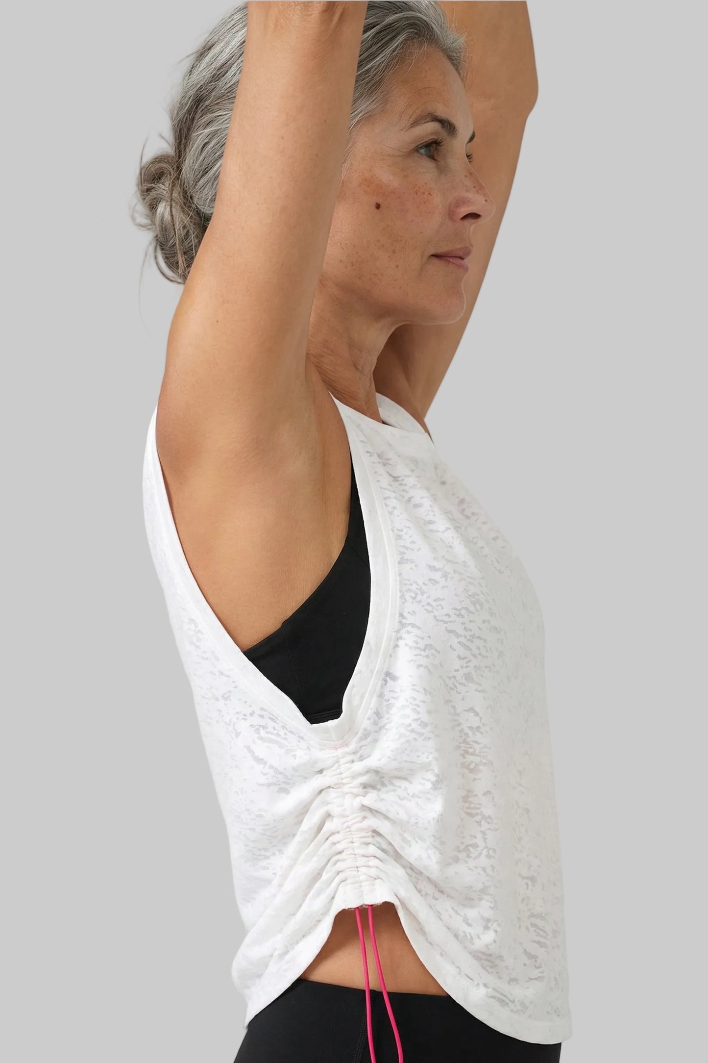 UAPA Flow Top in white — women's activewear top