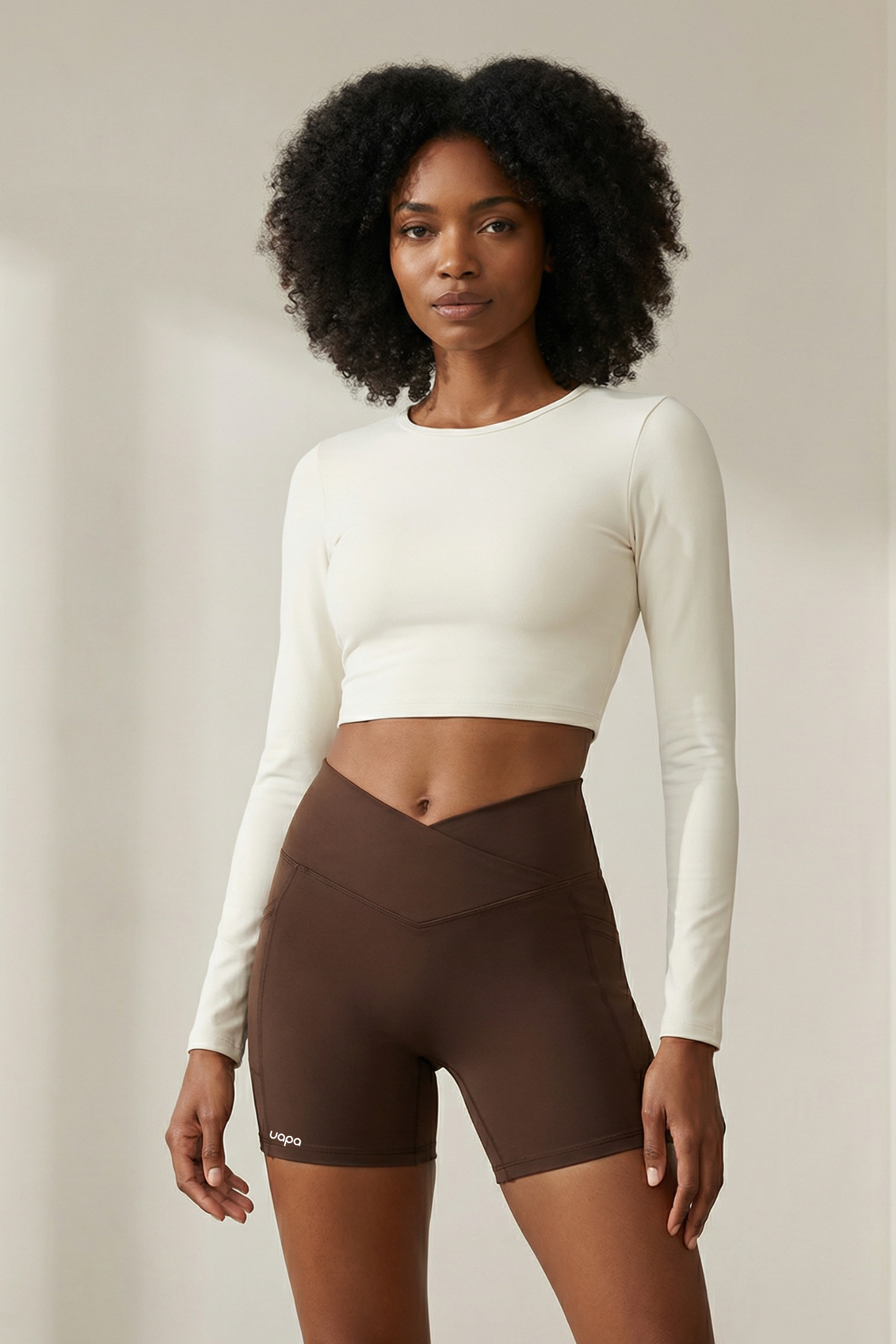 UAPA Everyday Biker in brown — women's activewear biker shorts with UAPA logo