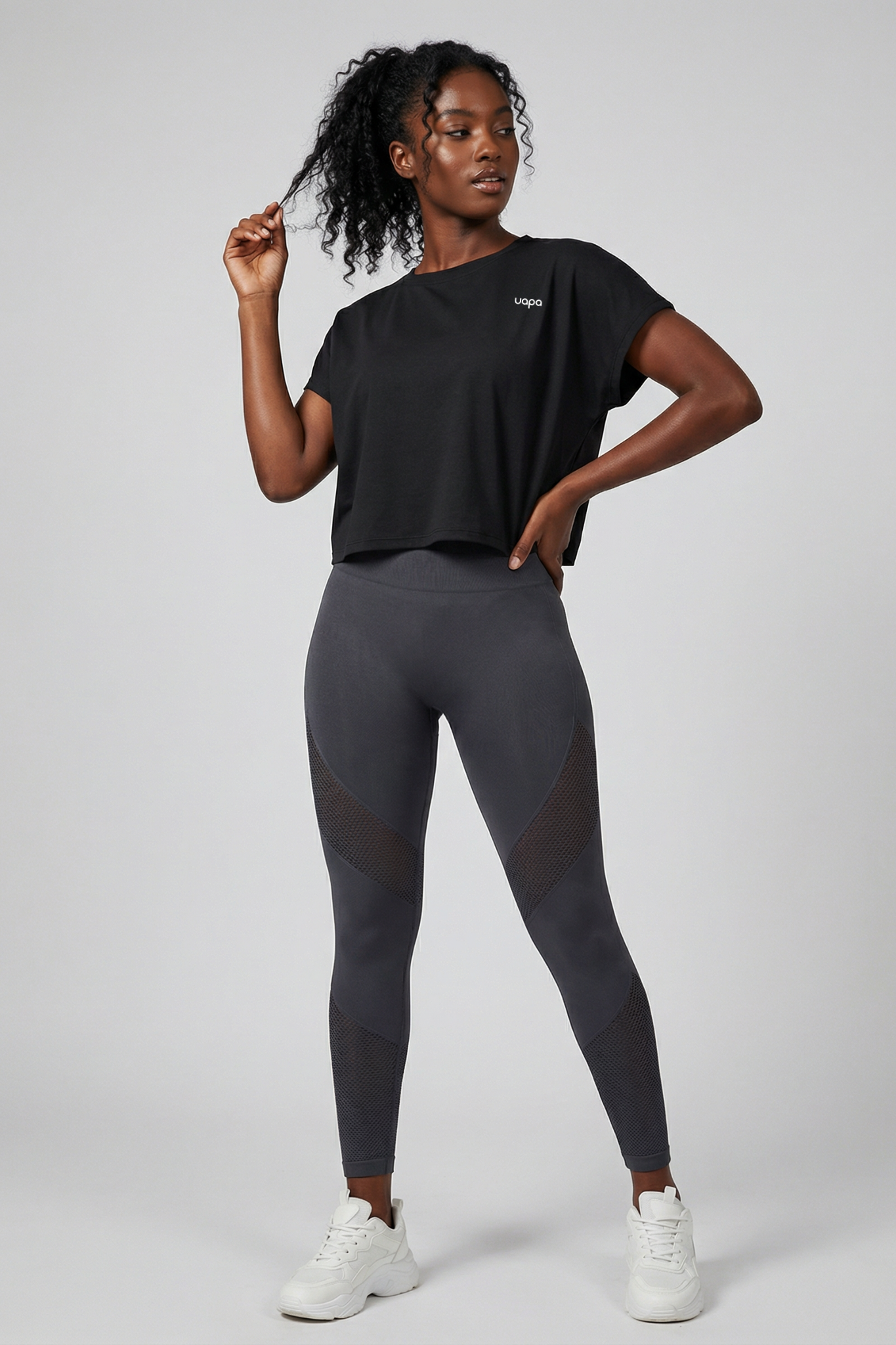 UAPA Motion Crop in black — women's activewear crop top with UAPA logo
