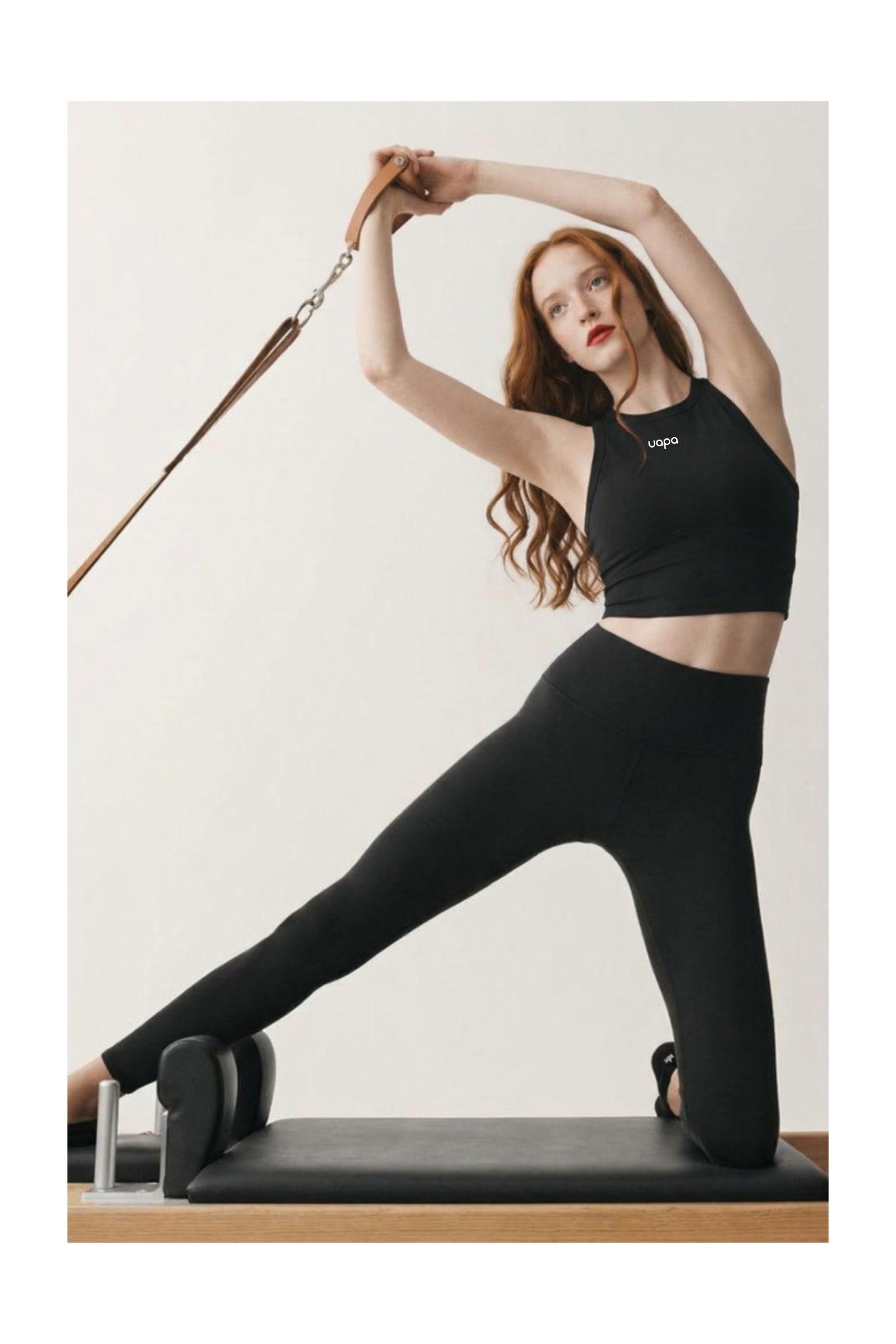 UAPA Crop Tank in black — women's activewear tank top with UAPA logo