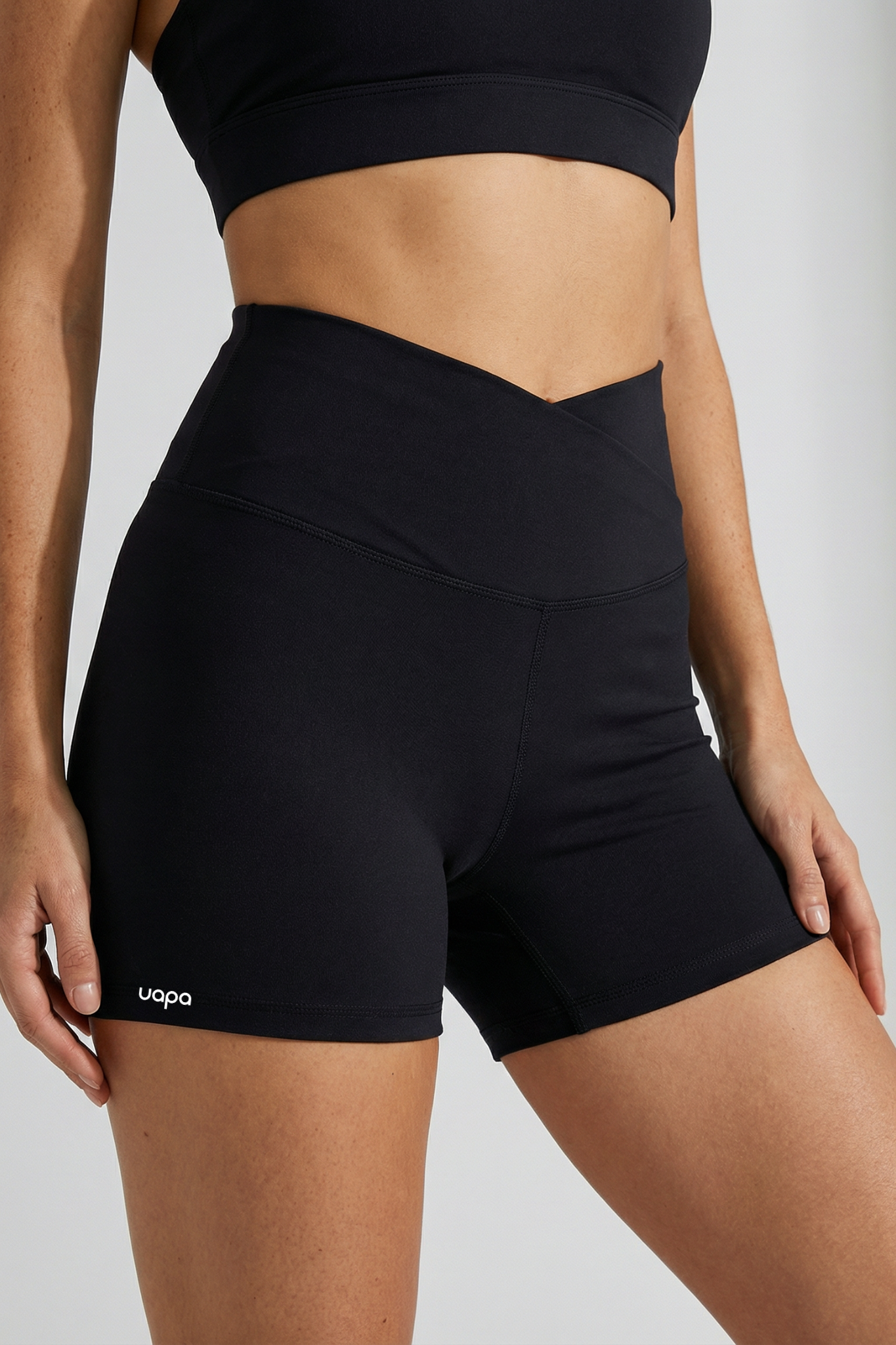 UAPA Core Biker in black — women's activewear biker shorts with UAPA logo
