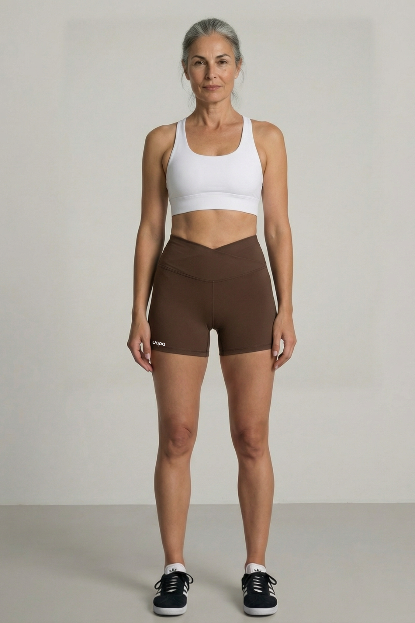 UAPA Core Biker in brown — women's activewear biker shorts with UAPA logo