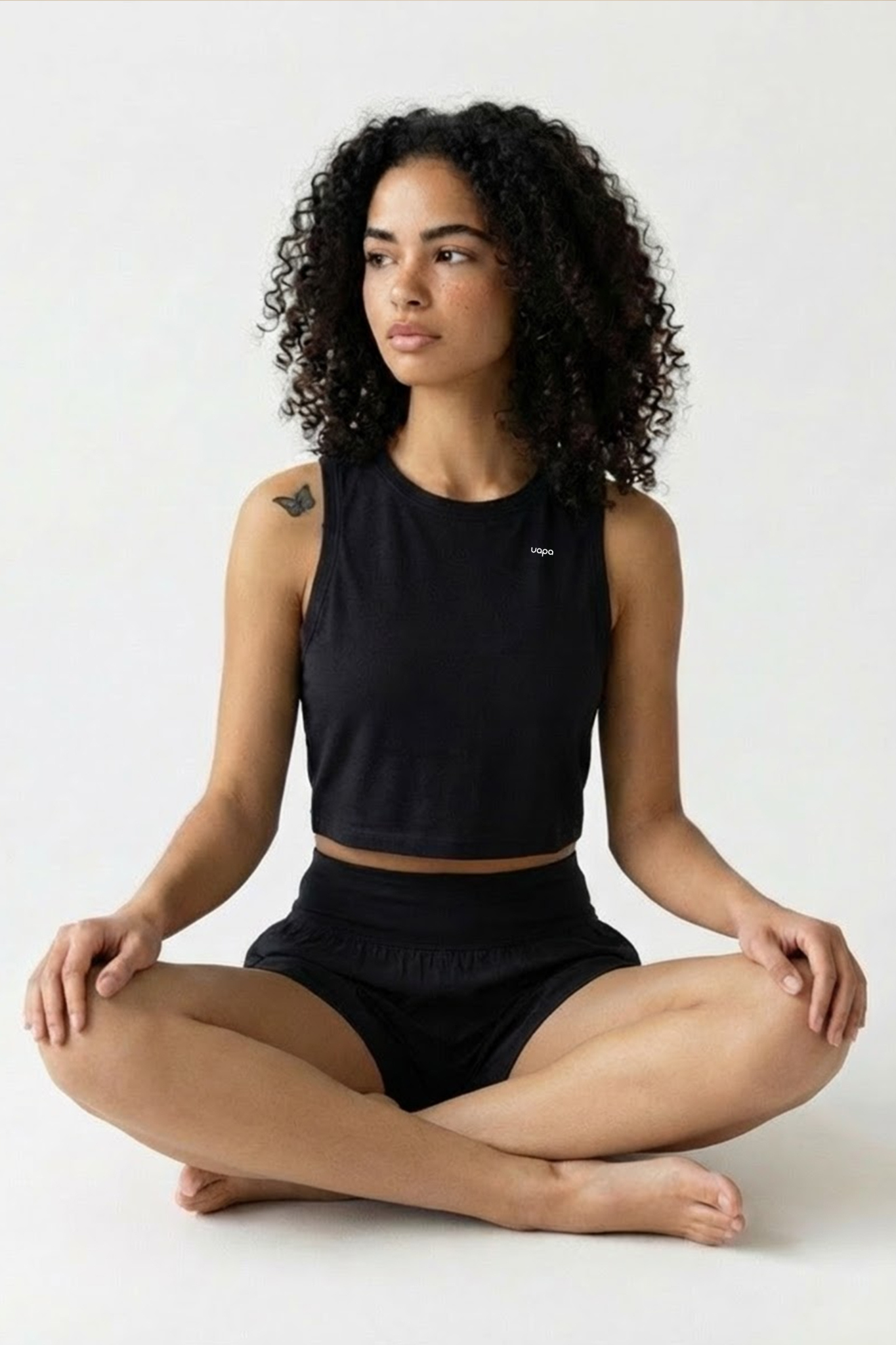 UAPA Studio Crop in black — women's activewear crop top with UAPA logo