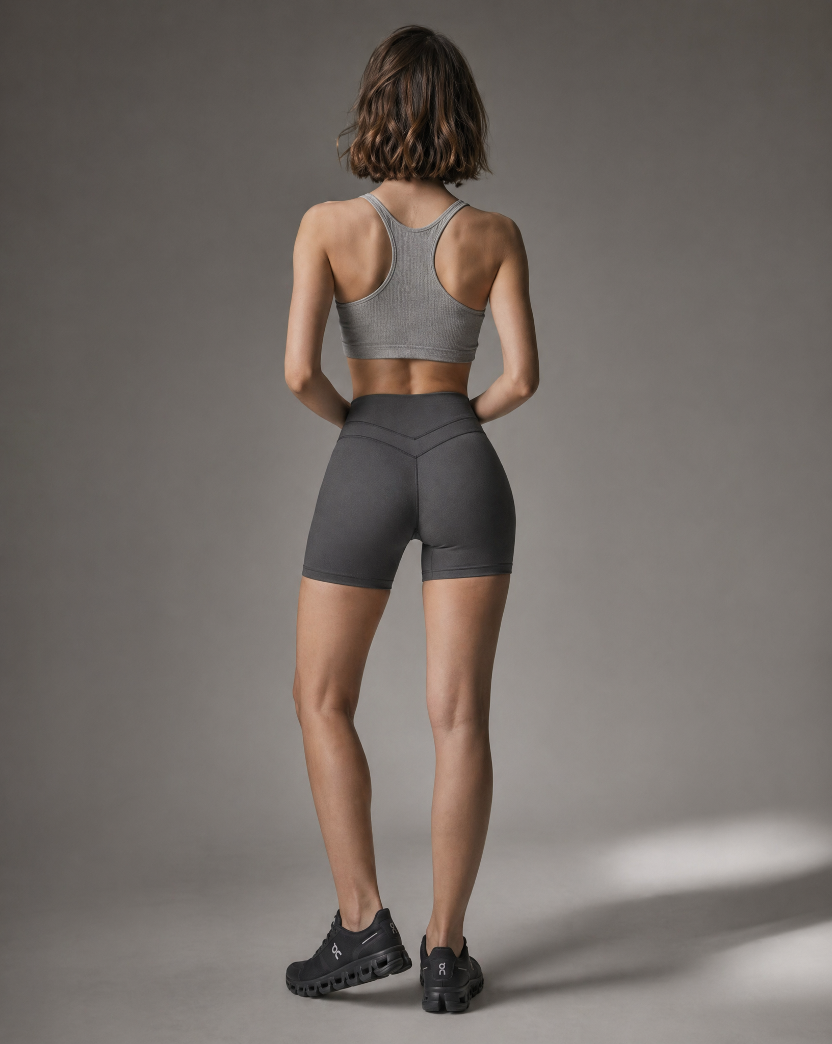 UAPA Motion Biker in grey — women's activewear biker shorts, back view